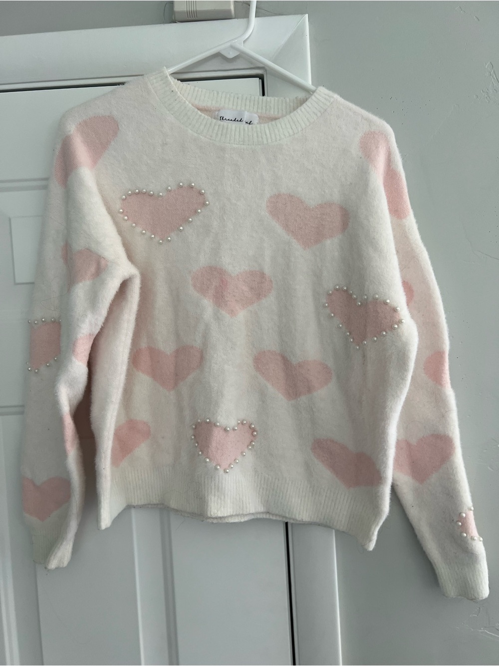 Women’s Cream Sweater with Pink Heart Pattern and Pearl Detail